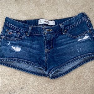 Dark washed jean semi ripped Hollister shorts.